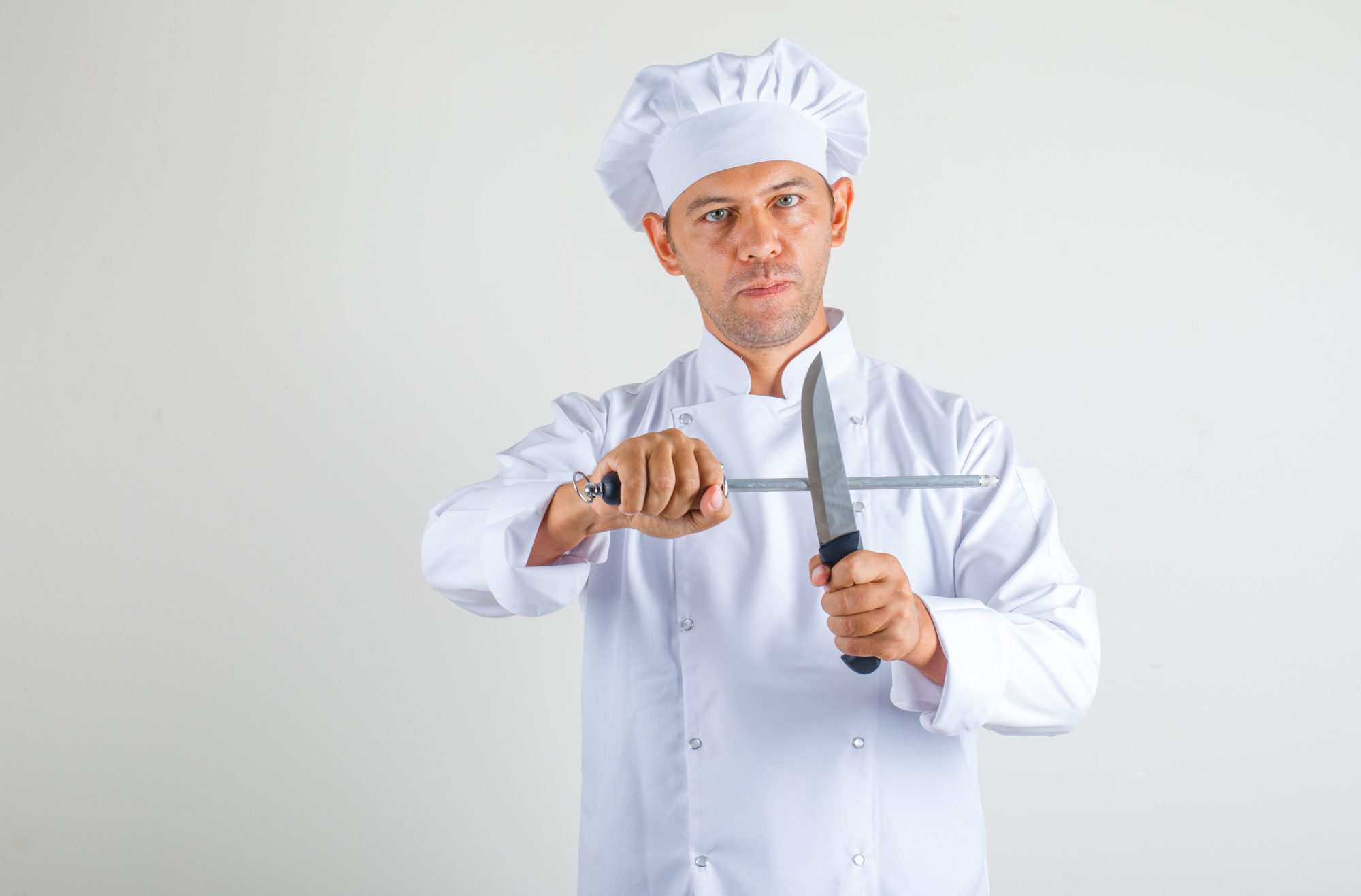 chef demonstrating knife technique